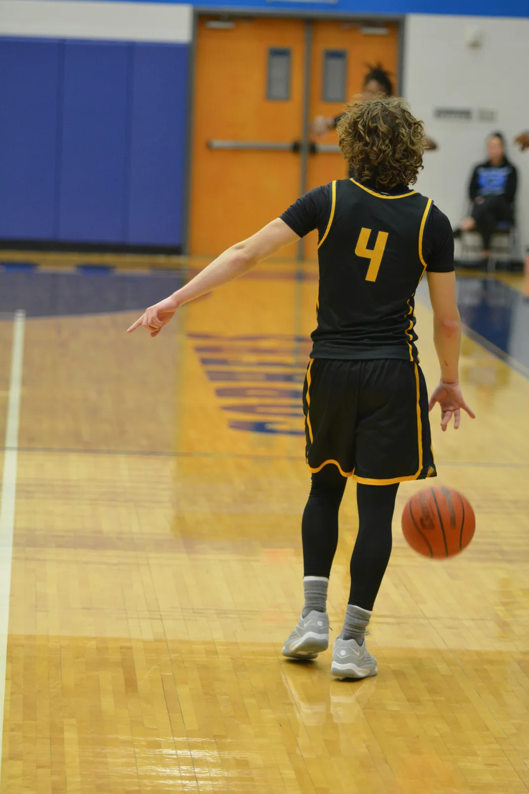 Basketball youth athlete in defensive stance